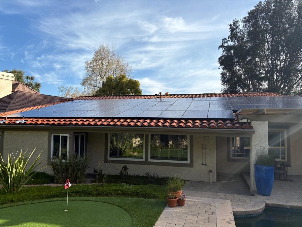Completed residential solar-panel installation on a tile roof